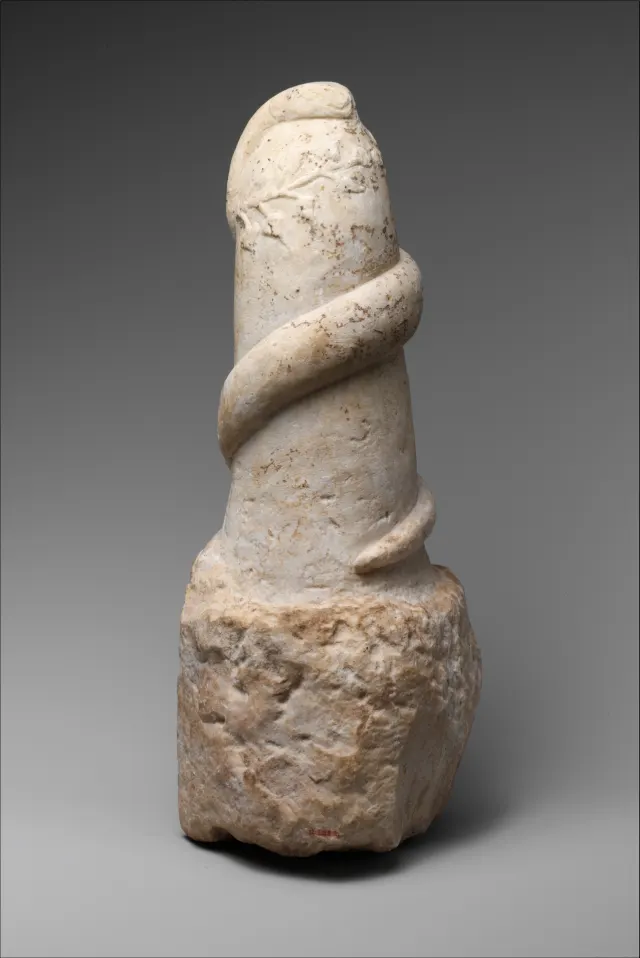 Marble pillar with snake and wreath