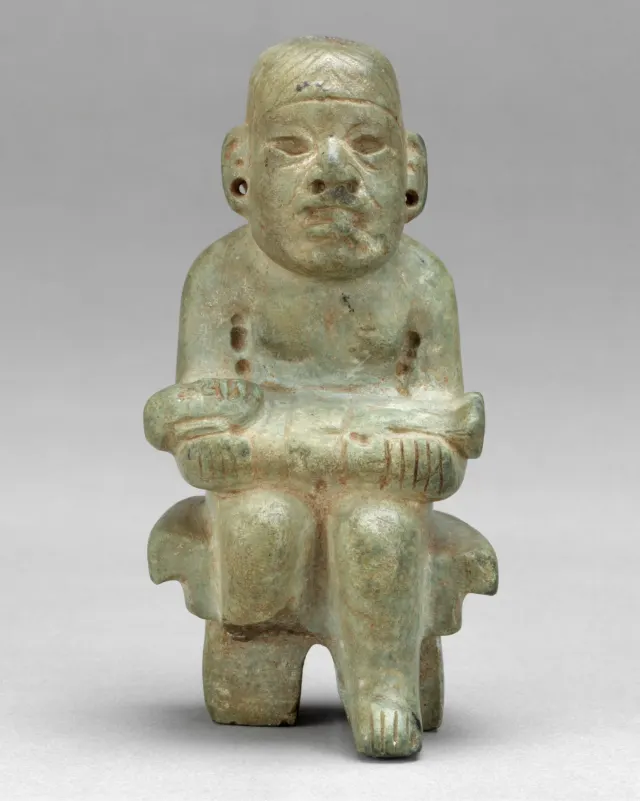 Figure seated on a bench