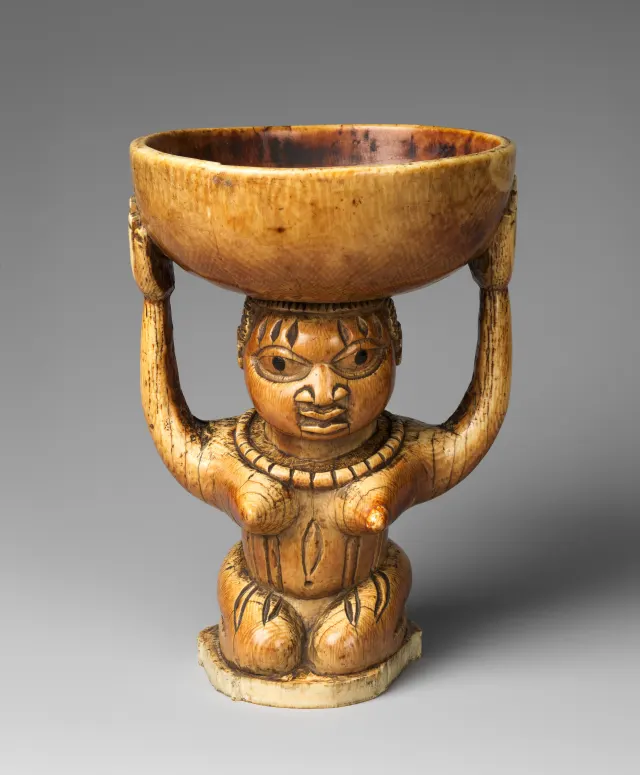 Àgéré Ifá (Ifá divination vessel) with kneeling woman